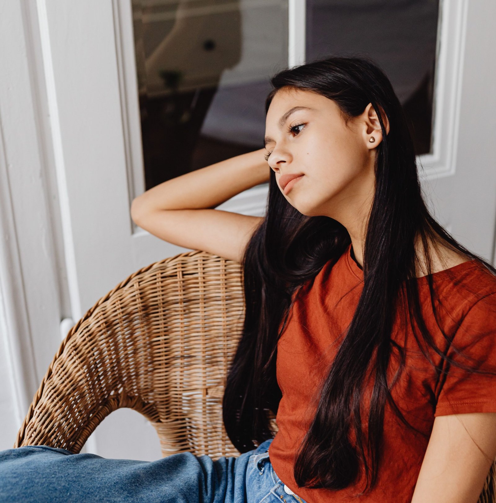 Adult reflecting calmly in a peaceful indoor setting
